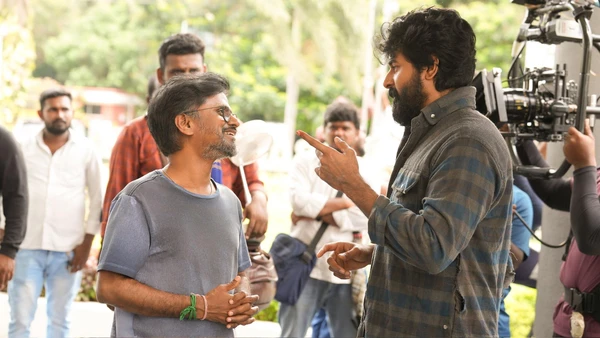 An actor and the director communicate on the set of "Madharaasi".