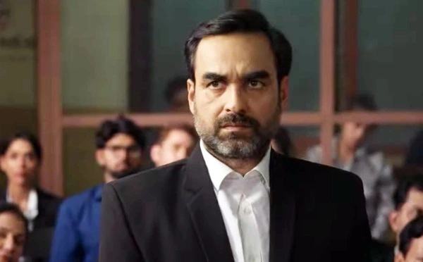 Veteran lawyer Madhav Mishra looks stern in a courtroom full of people in Criminal Justice: A Family Matter.